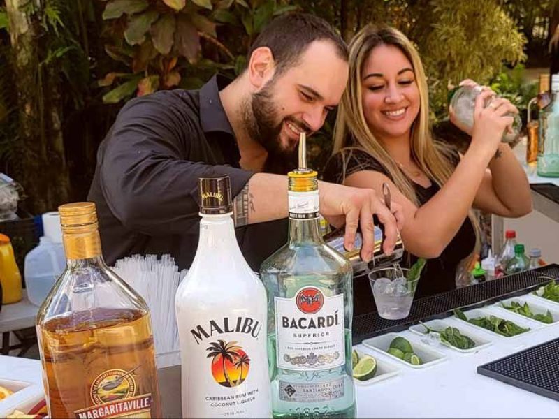 Professional Fire Water Bars staff serving guests at a corporate networking event